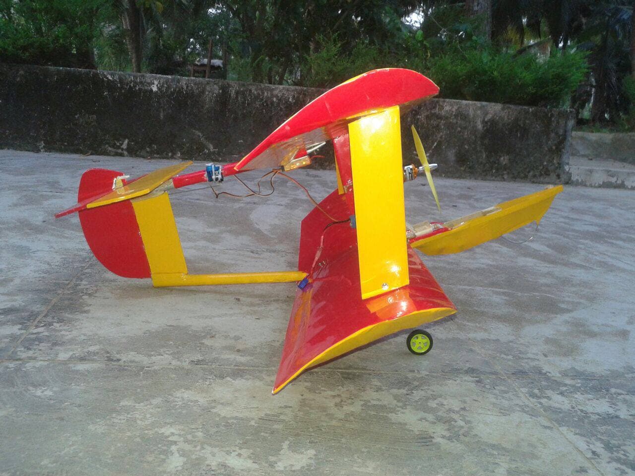 "Electric-powered balsa wood biplane designed for hobby flying, featuring a vibrant red and yellow design."