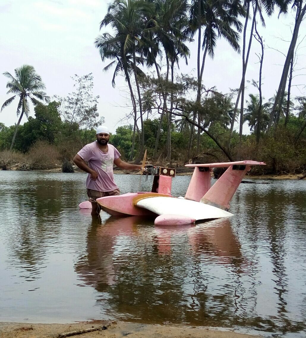 Experimental wing-in-ground effect vehicle with an 80cc petrol engine in a shallow water body.
