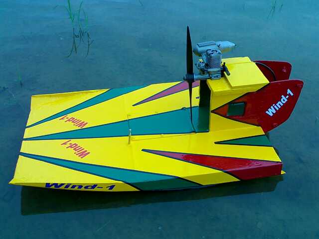 5cc UMS nitro methane-powered remote-controlled boat with a plywood construction, designed for high-speed water navigation and racing.